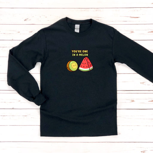 a black shirt with a watermelon and a slice of watermelon on