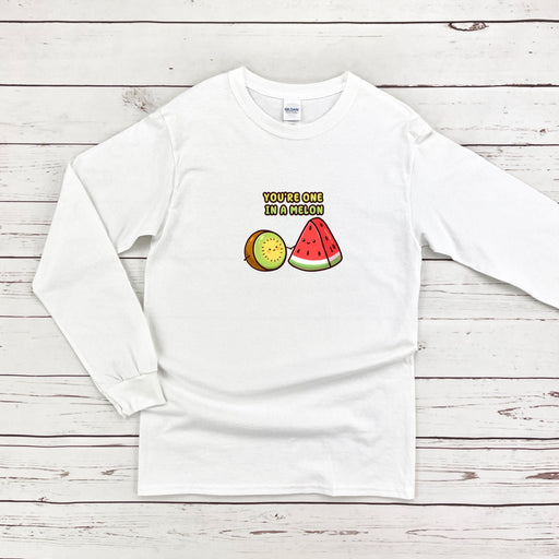 a white shirt with a watermelon and kiwi on it