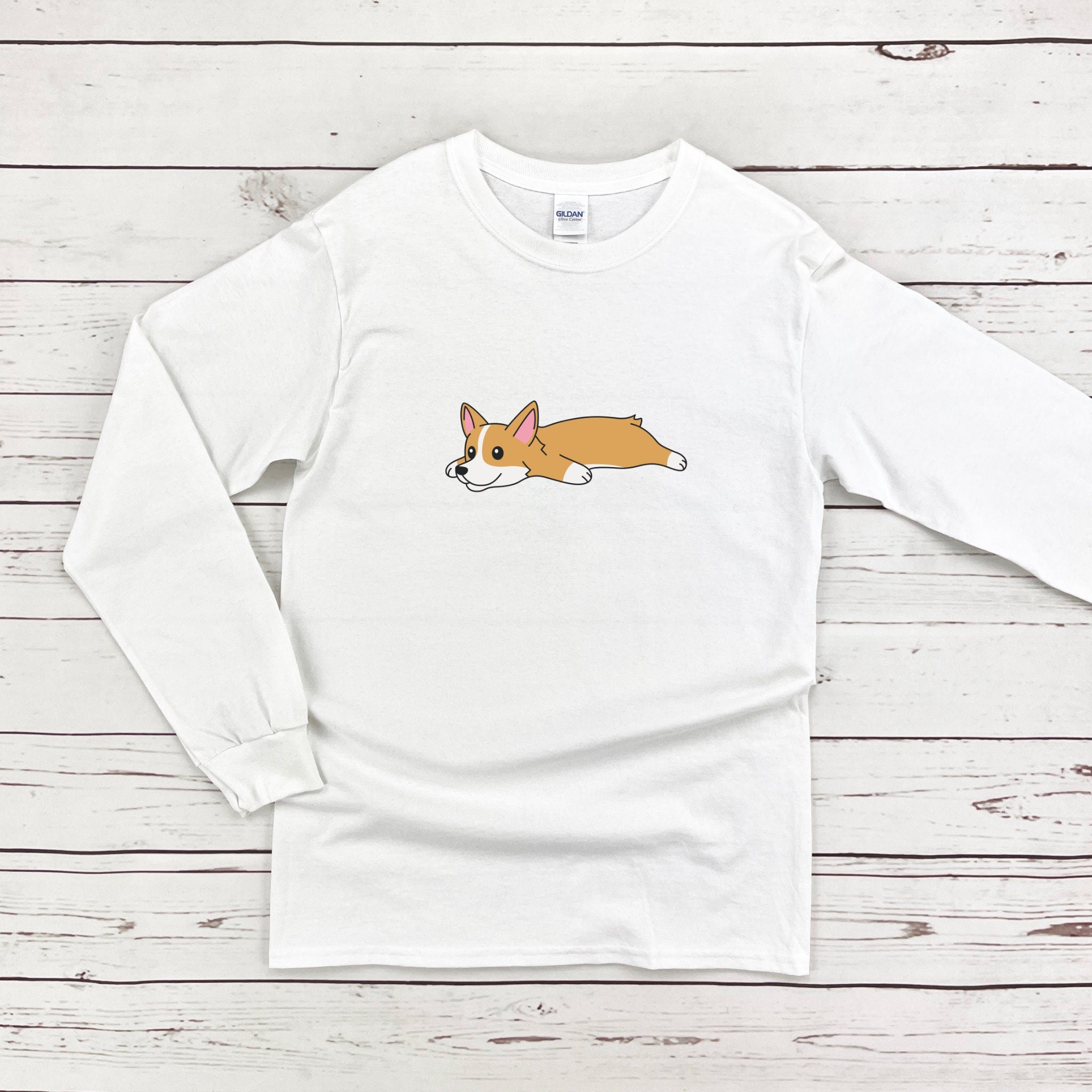 a white t - shirt with a brown and white dog on it