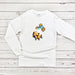 a white t - shirt with a picture of a dog on it