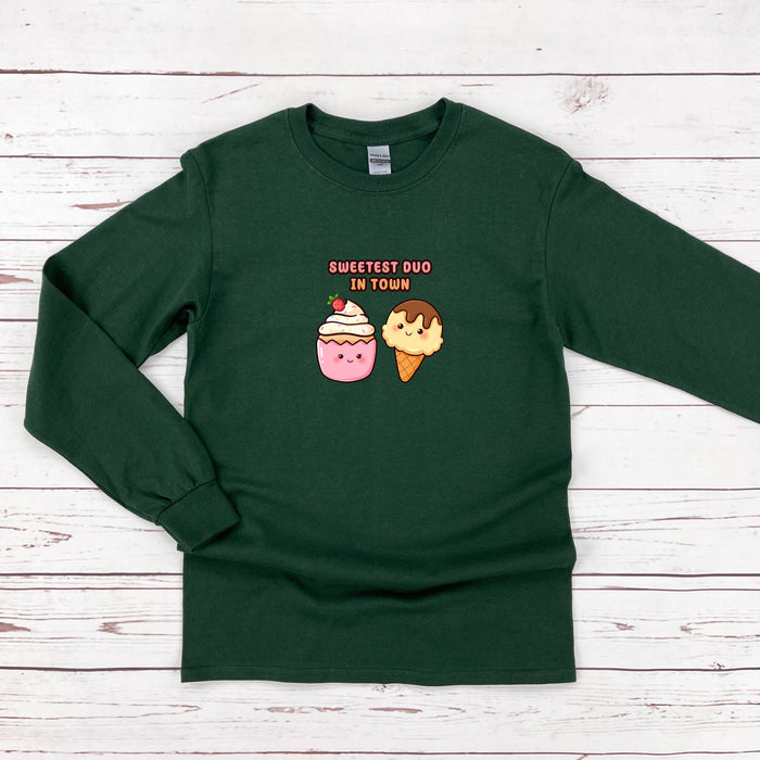 a green shirt with two donuts on it