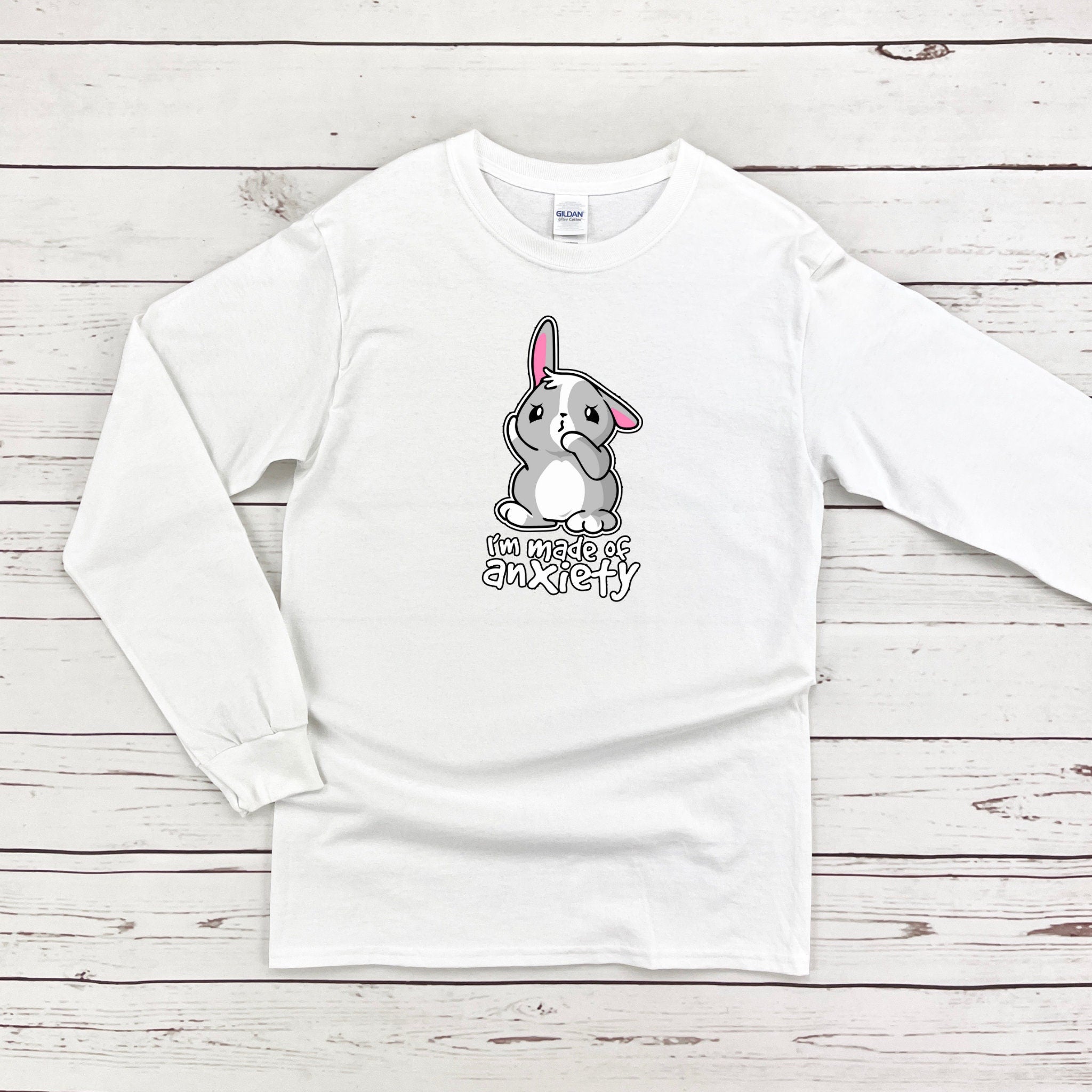 a white long sleeve shirt with a cartoon bunny on it