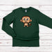 a green shirt with a cartoon monkey on it