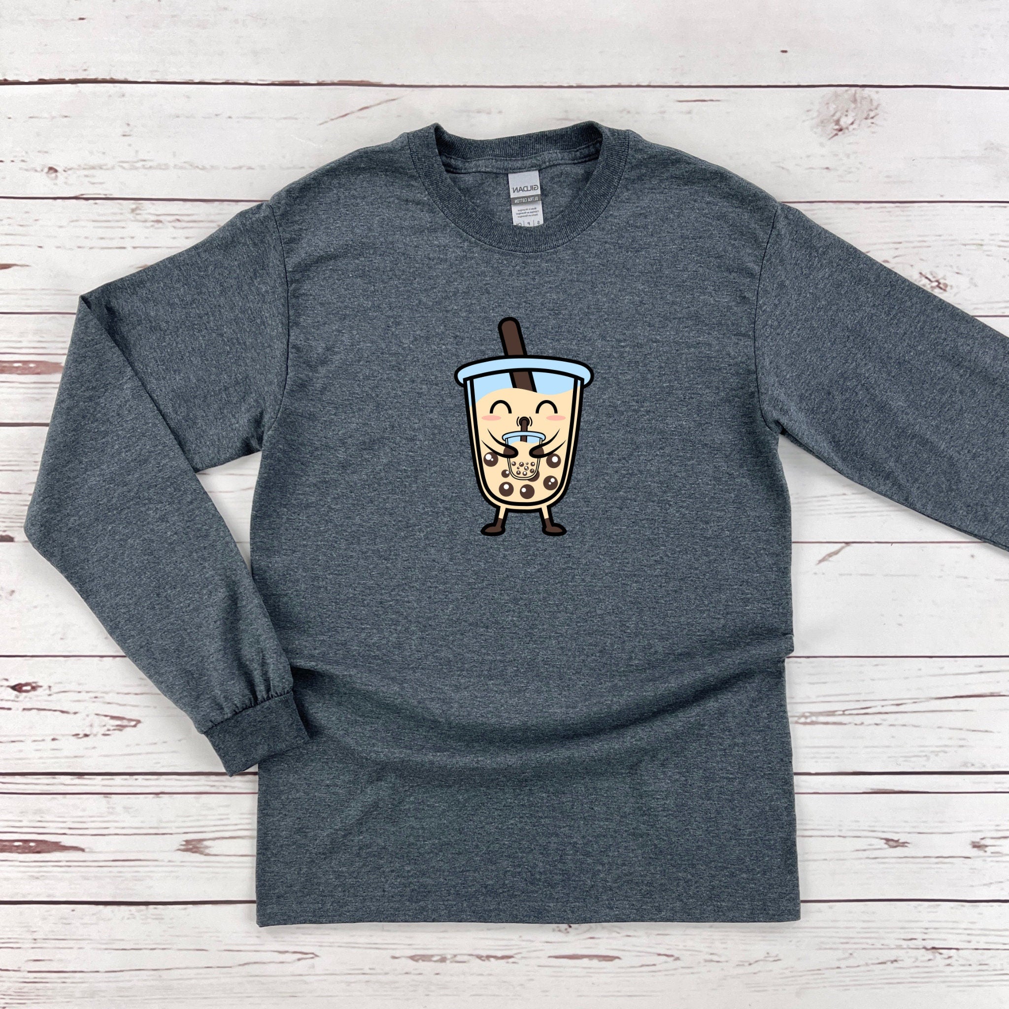 a gray shirt with a cartoon of a cup of coffee on it