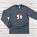 a long sleeved shirt with a penguin and penguin on it