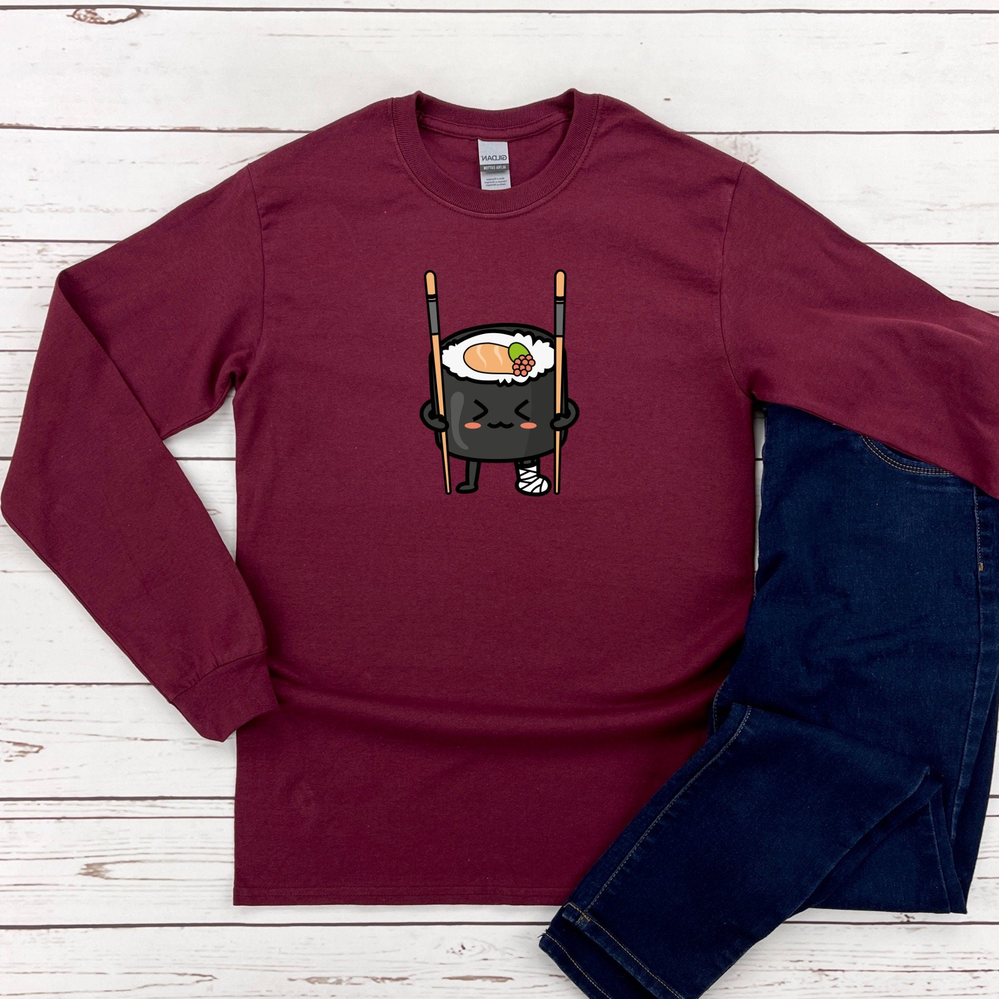 a red shirt with a sushi character on it