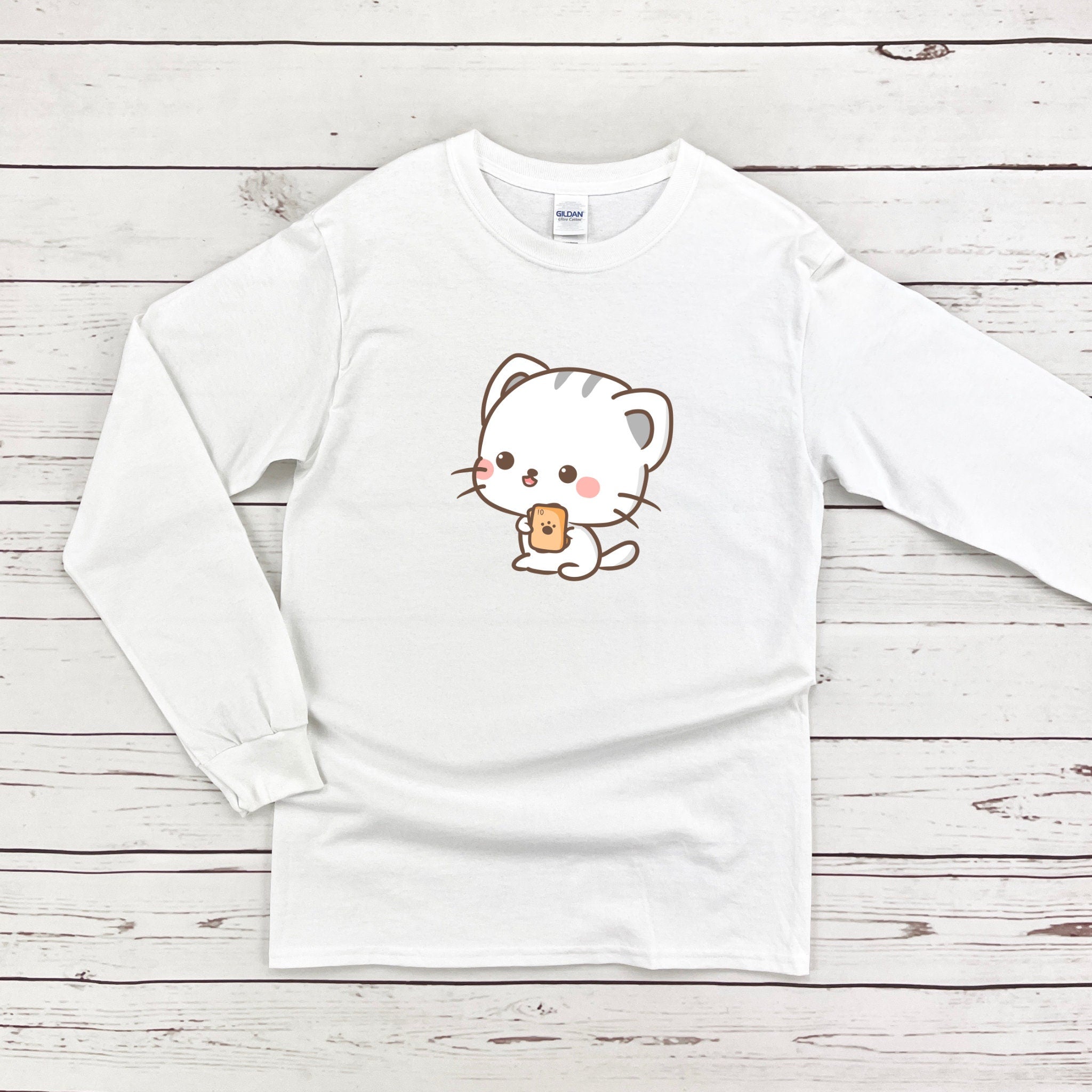 a white t - shirt with a cat eating a donut