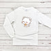 a white t - shirt with a cat eating a donut