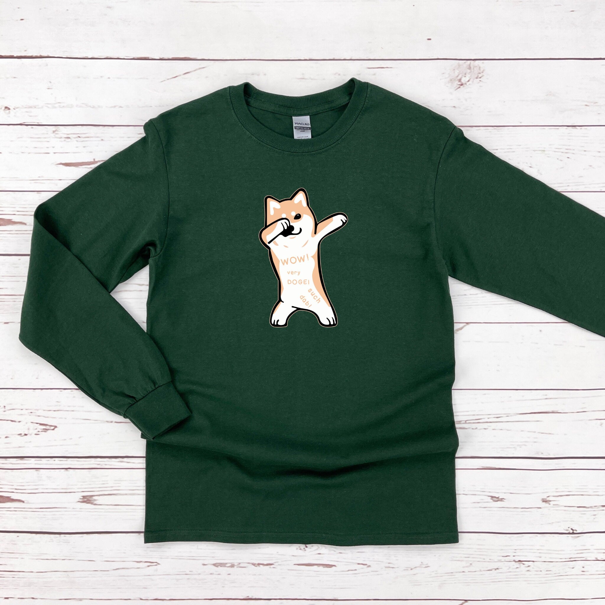 a green shirt with a dog on it