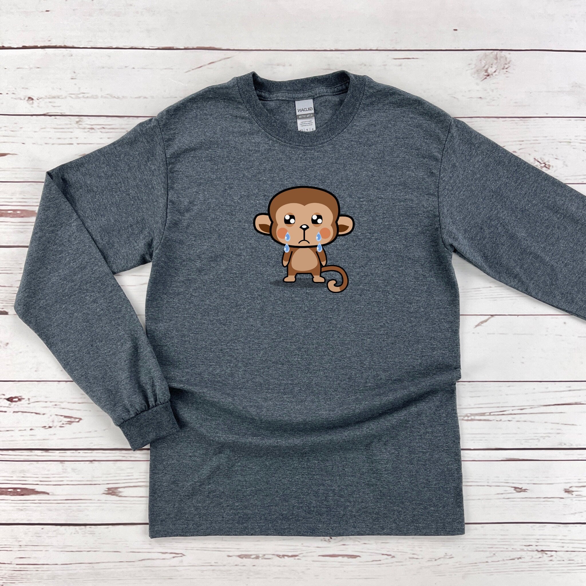 a gray shirt with a monkey on it
