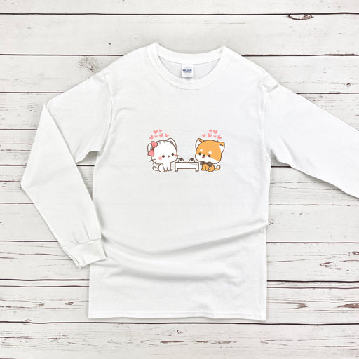 a white long sleeve shirt with a dog and cat on it