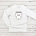 a white shirt with a small white dog wearing a bow