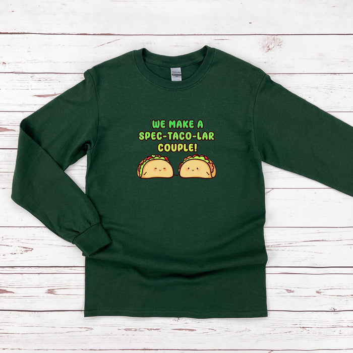a green sweatshirt with two tacos on it