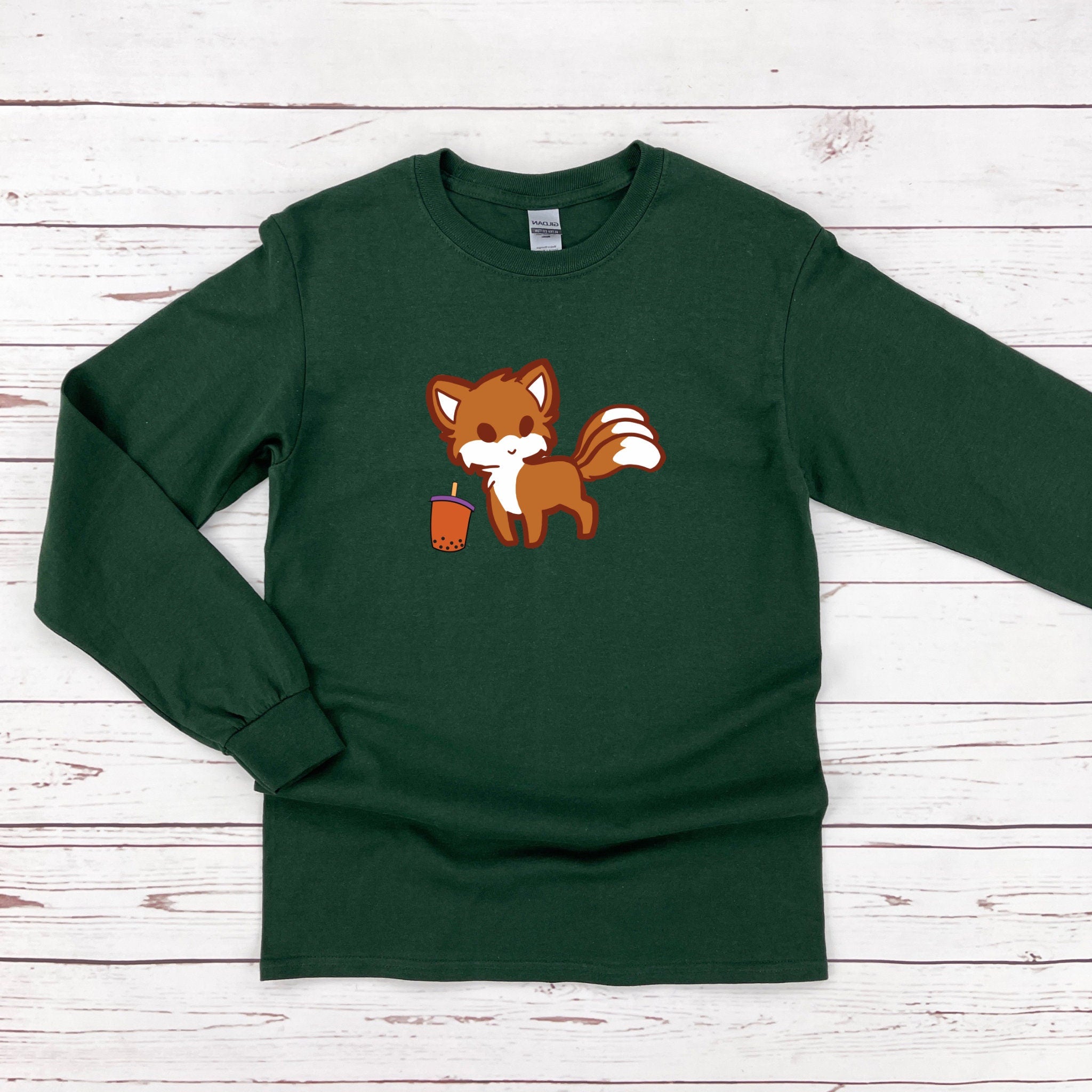 a green shirt with a fox on it