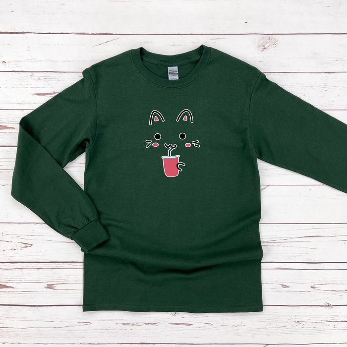a green long sleeved shirt with an image of a cat