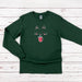 a green long sleeved shirt with an image of a cat