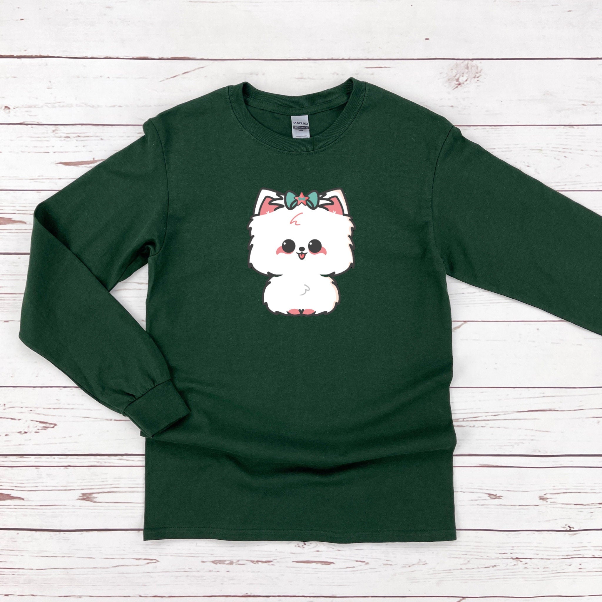 a green shirt with a white dog on it