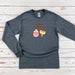 a long sleeved shirt with an image of two donuts and a cupcake