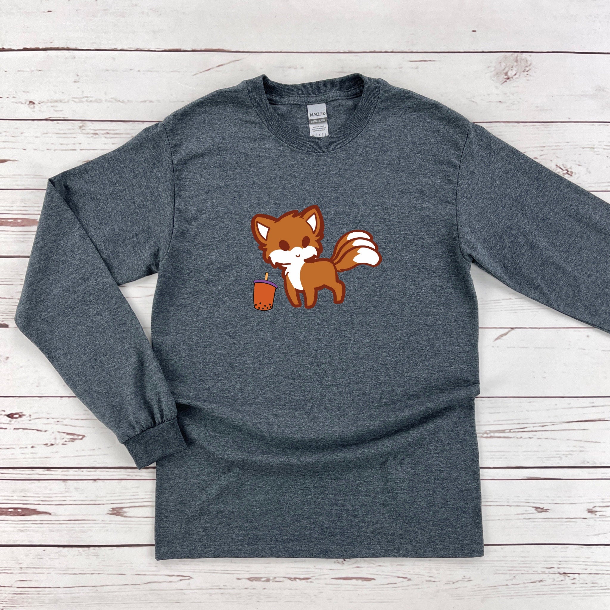 a long sleeved shirt with a fox on it