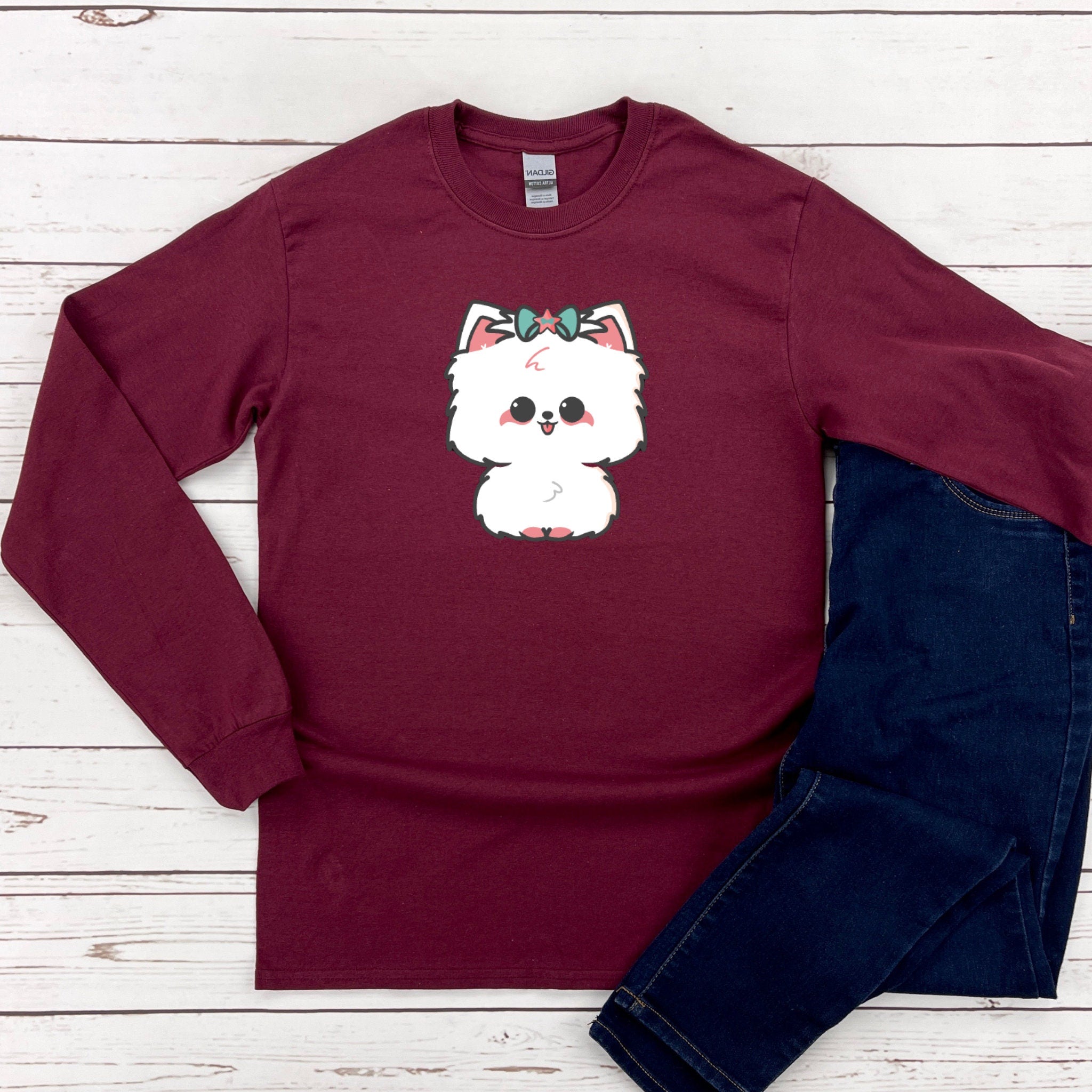 a red shirt with a white dog on it