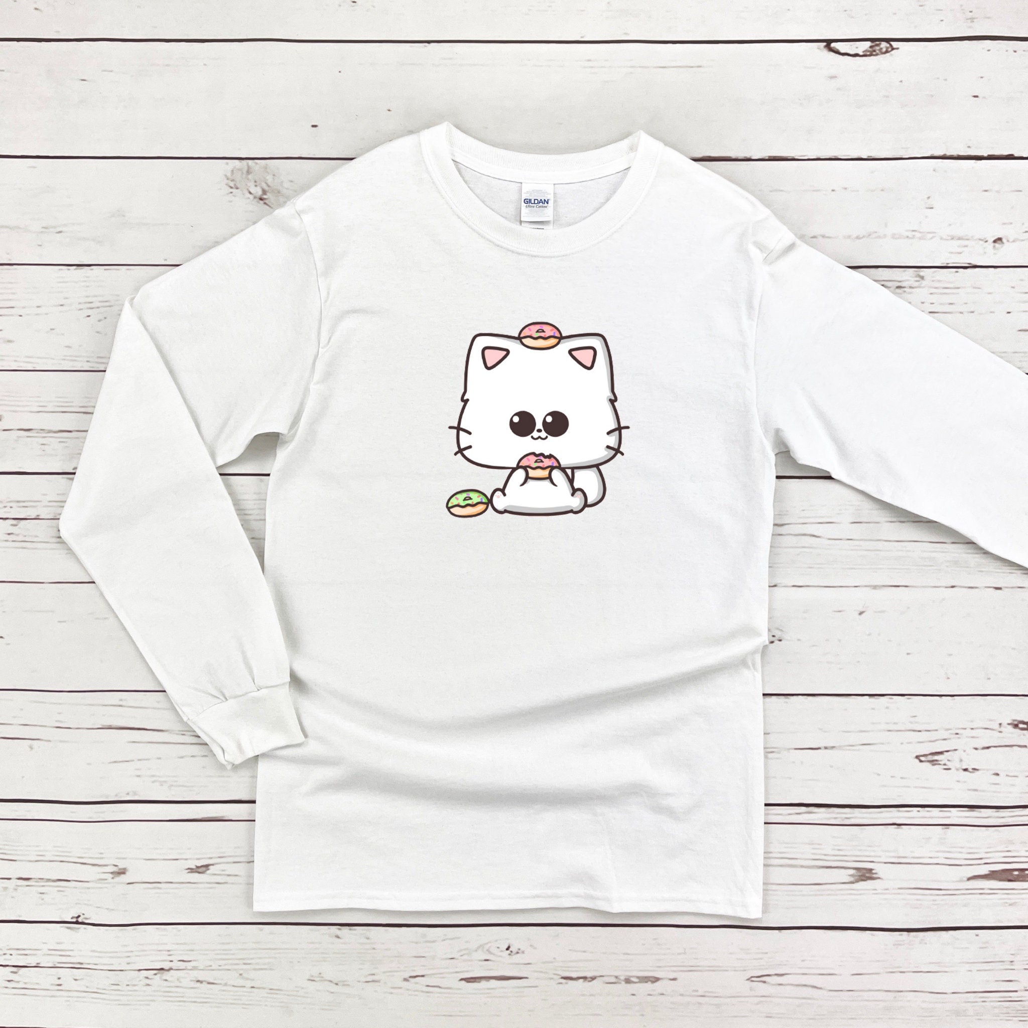 a white shirt with a cat on it