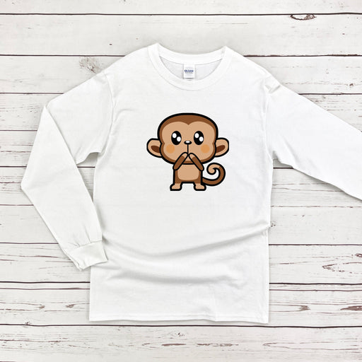 a white shirt with a cartoon monkey on it