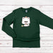 a green shirt with a white cat on it