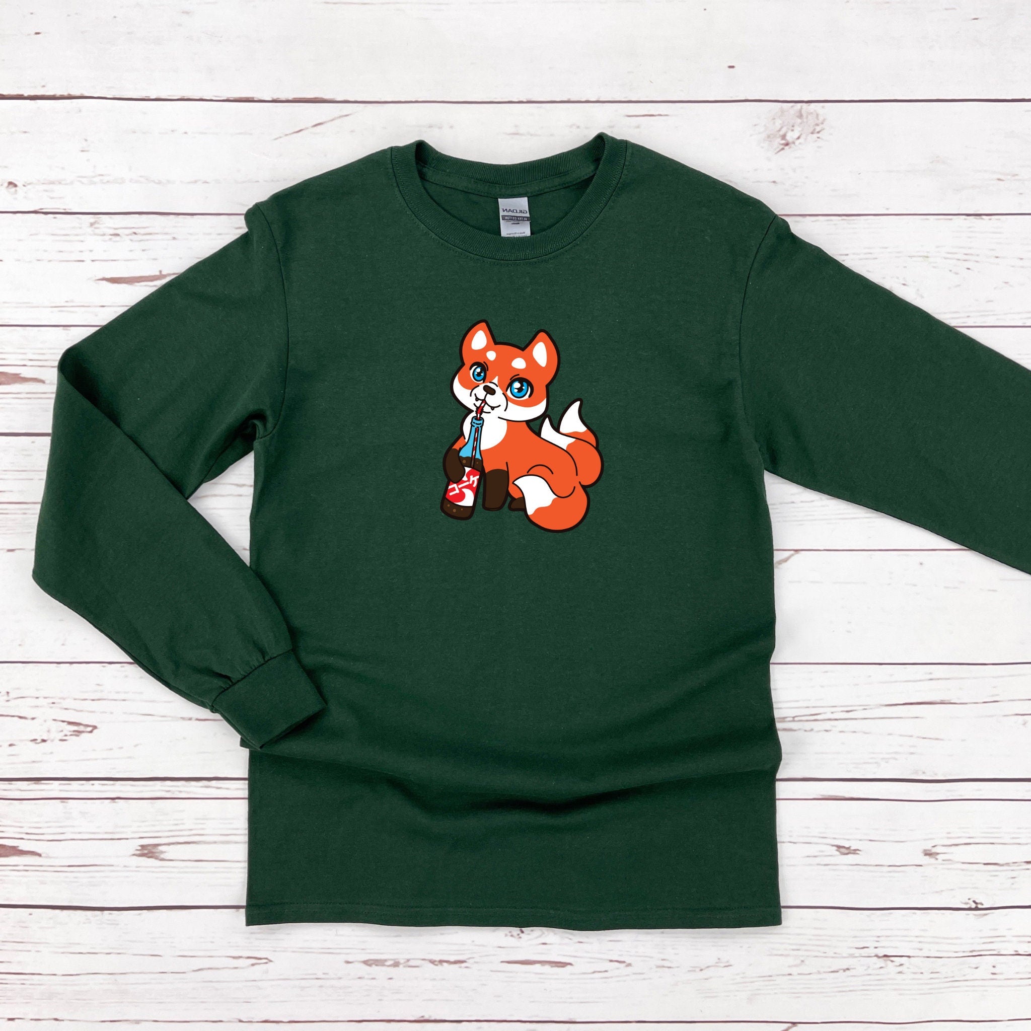 a green shirt with a fox on it
