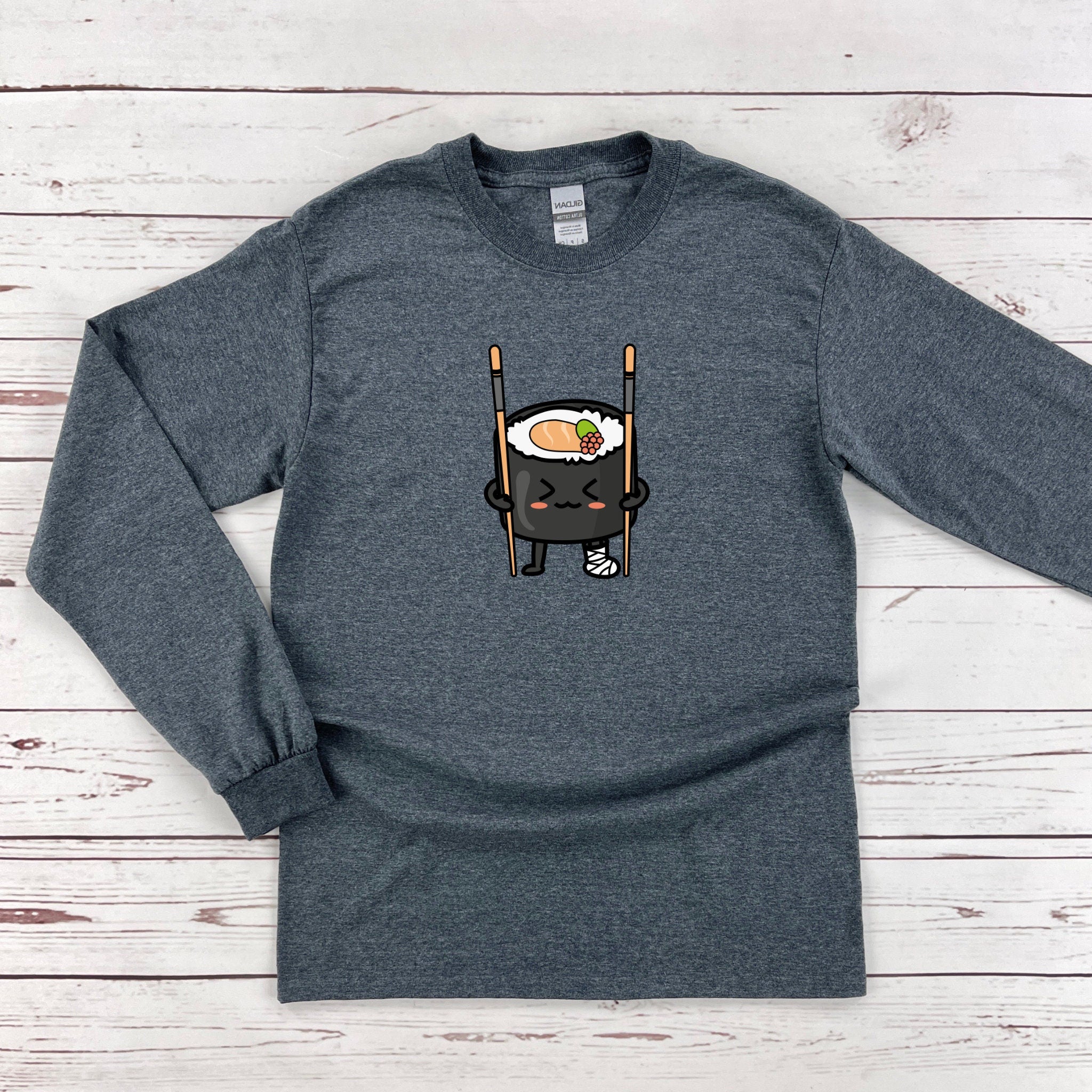a long sleeved shirt with a sushi on it