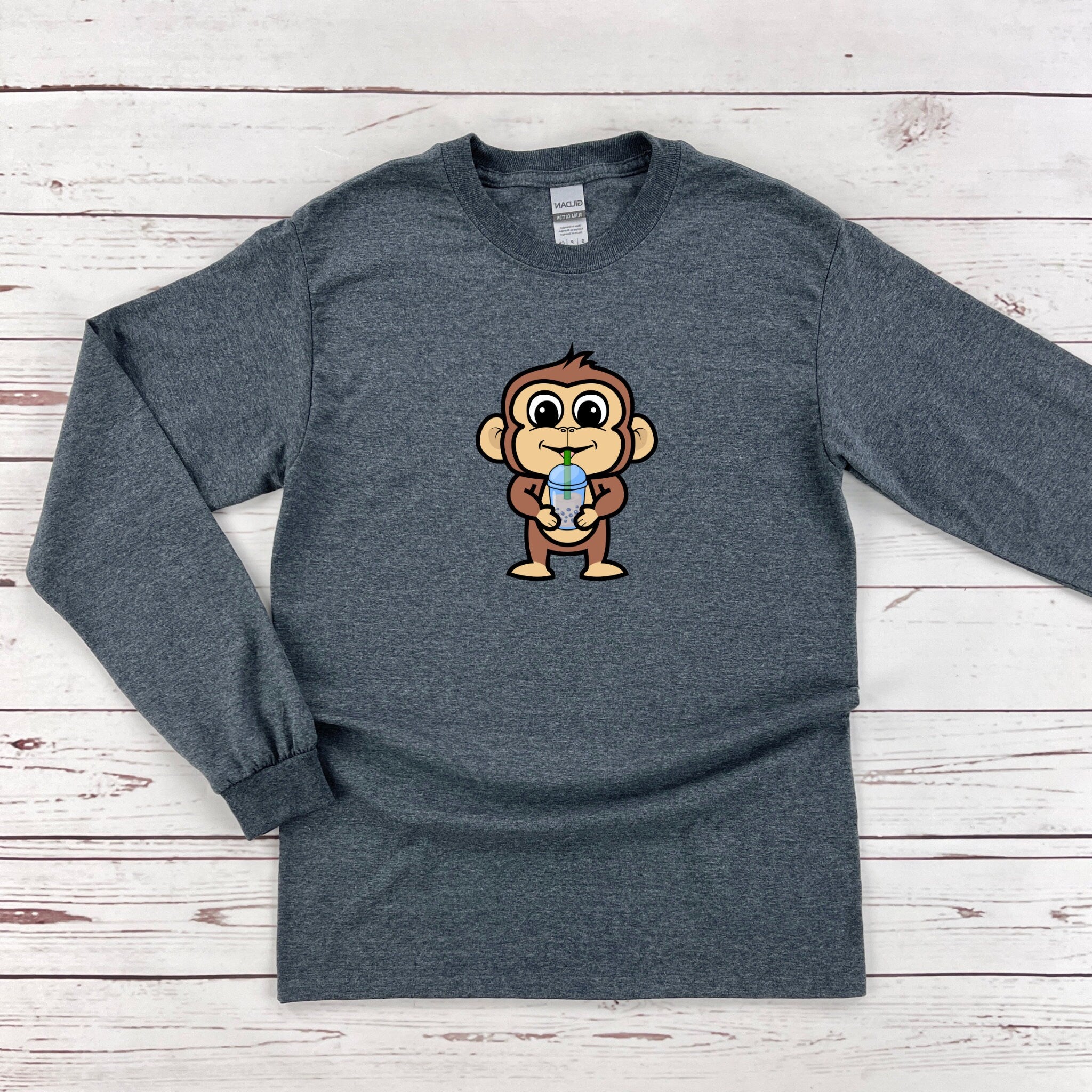 a gray shirt with a monkey on it