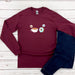 a pair of jeans and a maroon shirt with a picture of a cup of coffee