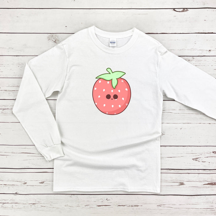 a white shirt with a strawberry on it