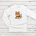 a white shirt with an orange fox on it