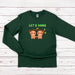 a green long sleeved shirt with two slots on it