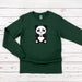 a green shirt with a panda bear on it
