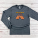 a gray shirt with a pair of boxing gloves on it