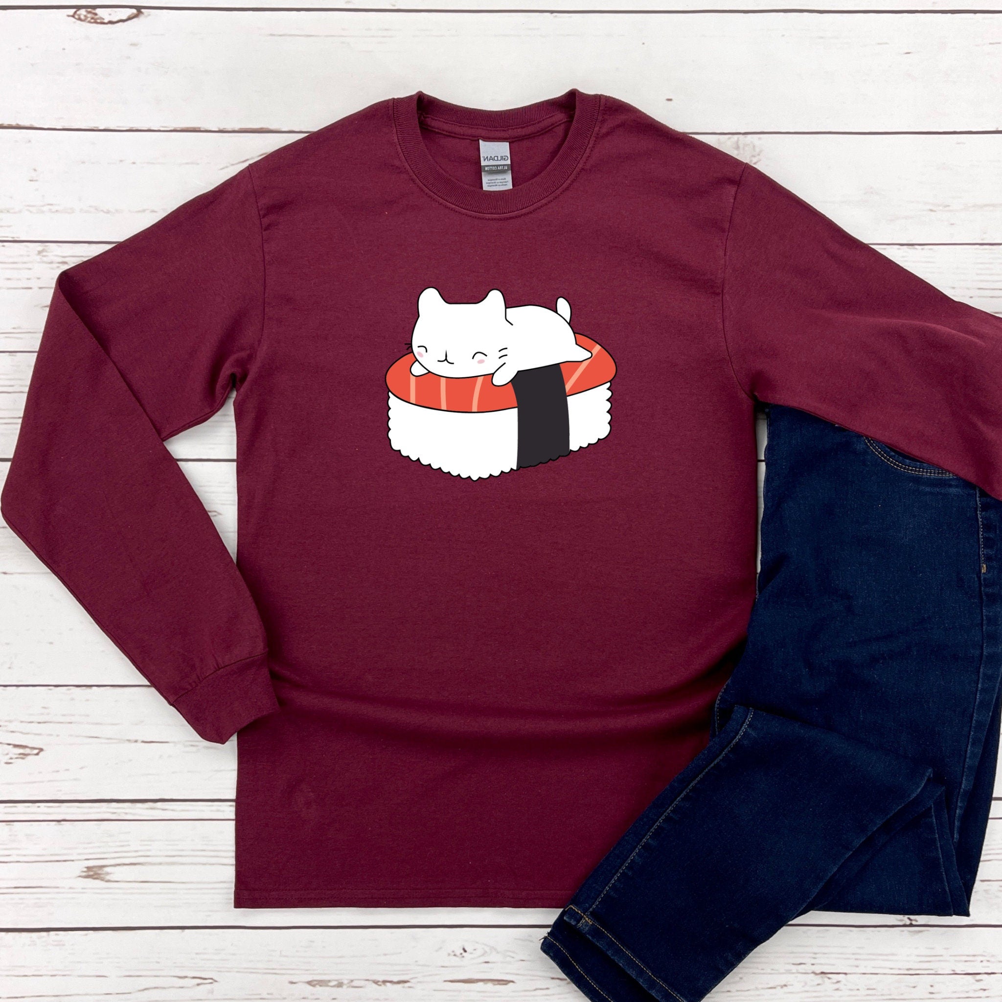 a red shirt with a sushi cat on it