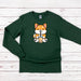 a green long sleeved shirt with a cartoon fox on it