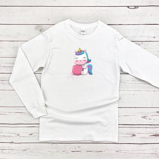 a white long sleeve shirt with a unicorn on it