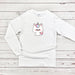 a white shirt with a unicorn on it