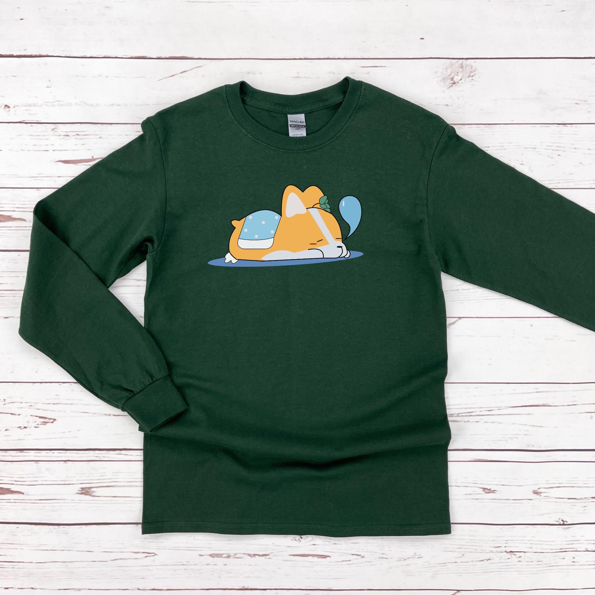 a green shirt with a dog laying on top of it