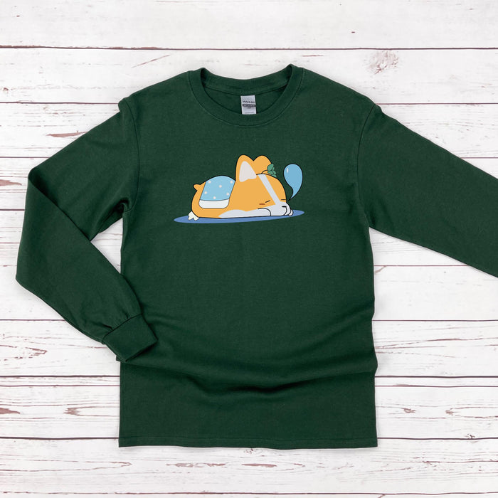 a green shirt with a dog laying on top of it
