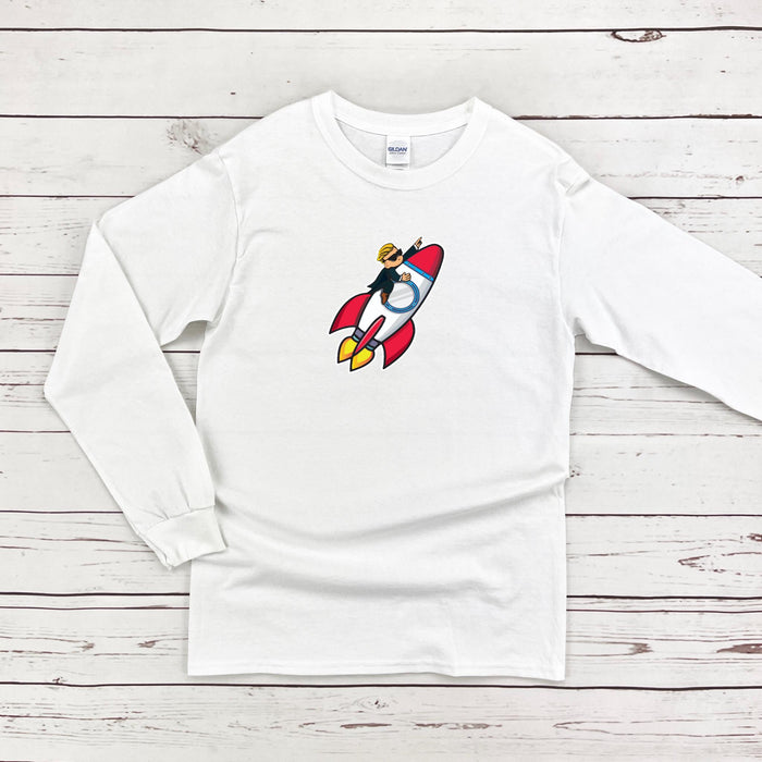 a white shirt with a cartoon rocket ship on it