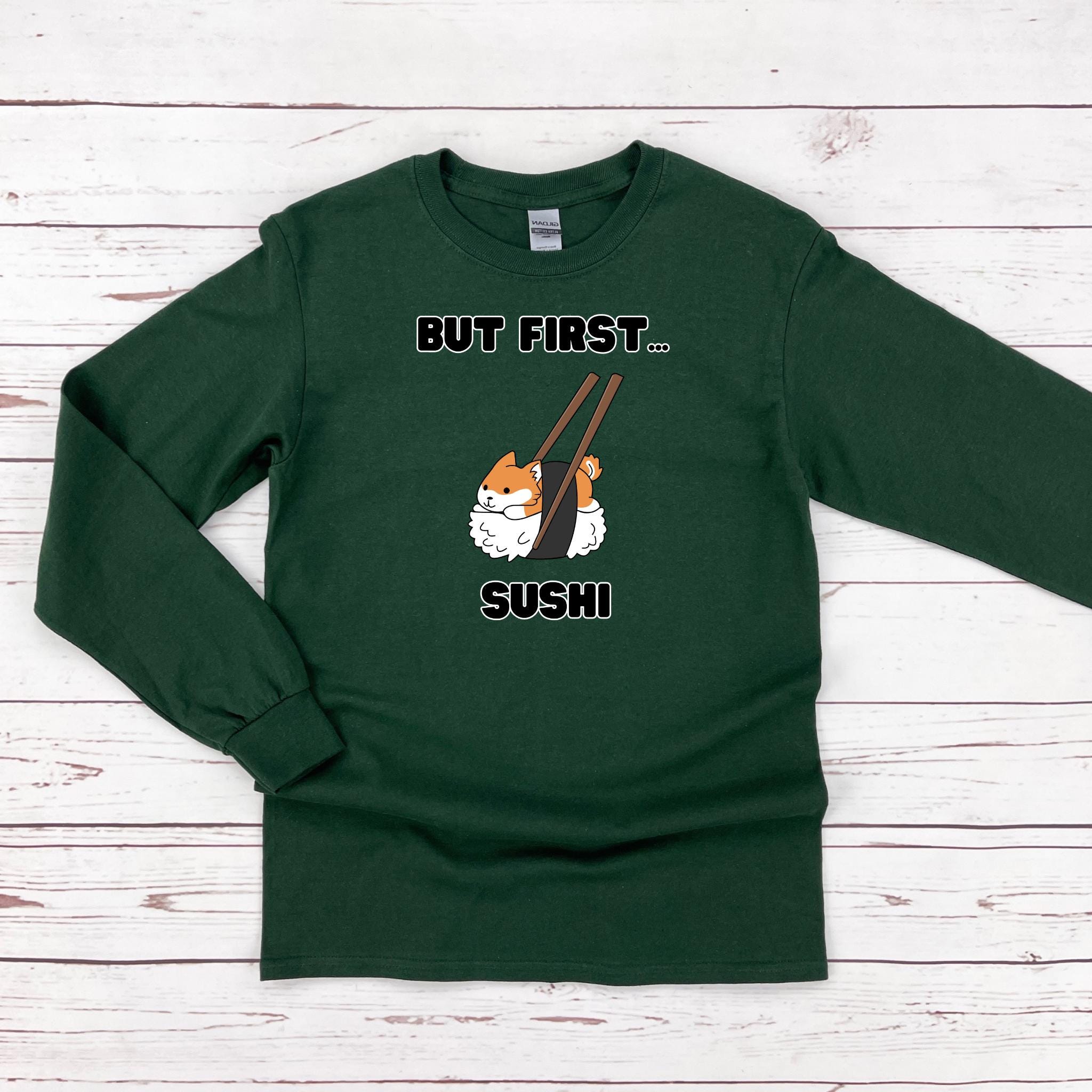 a green tshirt with a picture of a sushi on it