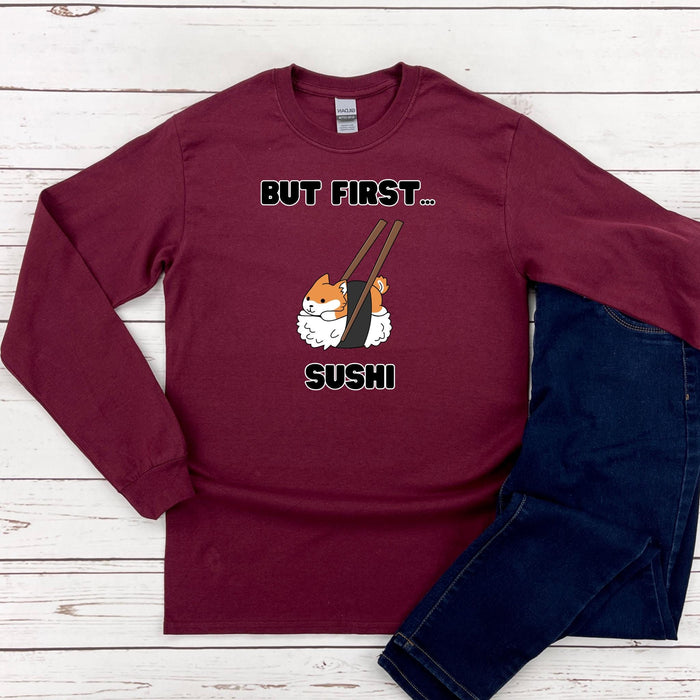 a red shirt that says but first, sushi