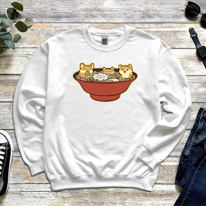 a sweatshirt with three cats in a bowl on it