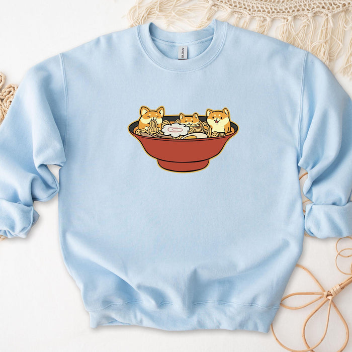 a blue sweatshirt with cats in a bowl on it