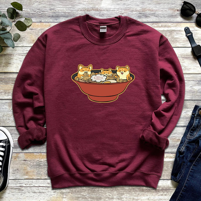 a red sweatshirt with three cats in a bowl on it