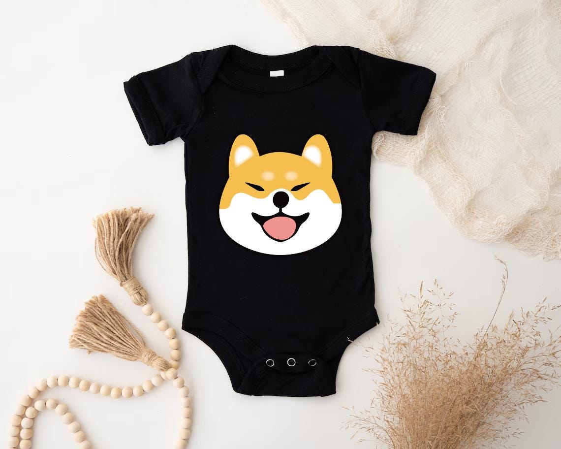 a baby bodysuit with a dog's face on it