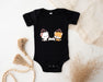a baby bodysuit with two dogs on it